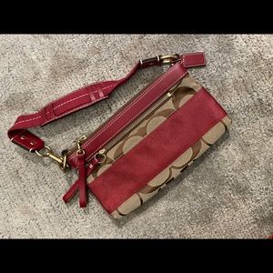 Classic Coach handbag with red stripe and clutch